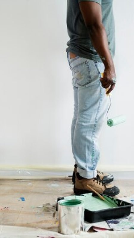 black-man-painting-house-wall_53876-19482