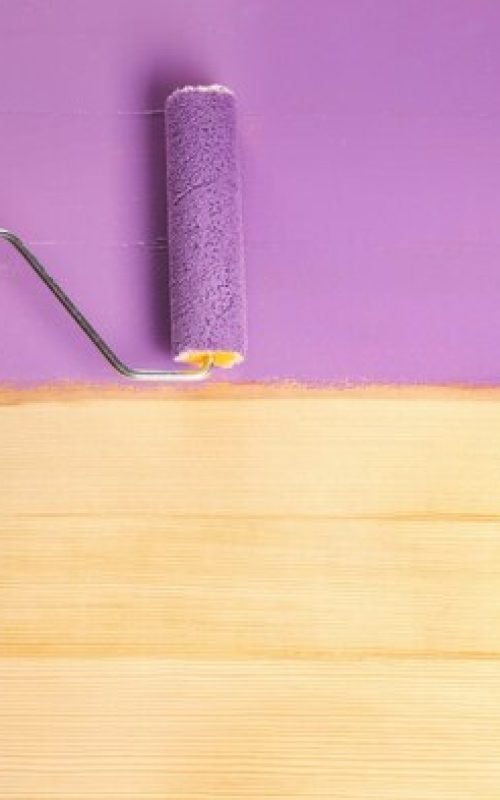 hand-painting-wooden-surface-with-violet-paint-closeup_392895-348855